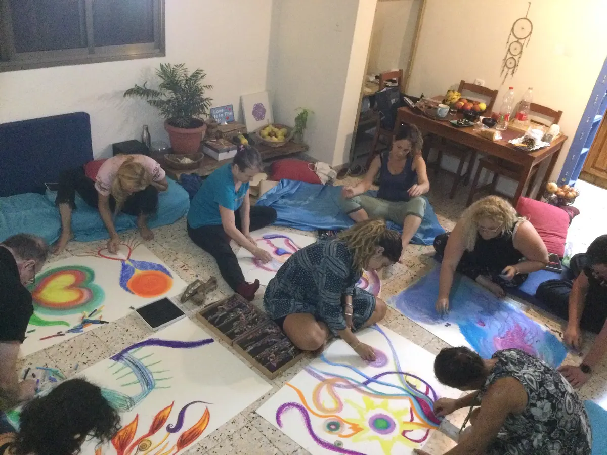 Participants creating together on the floor
